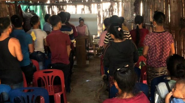 Lao Christians gather in their church building to worship the Lord