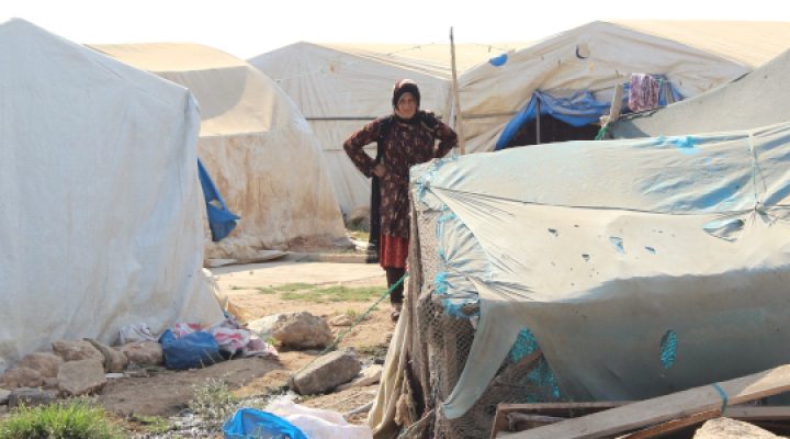 Turkish christian woman stands in a refugee camp